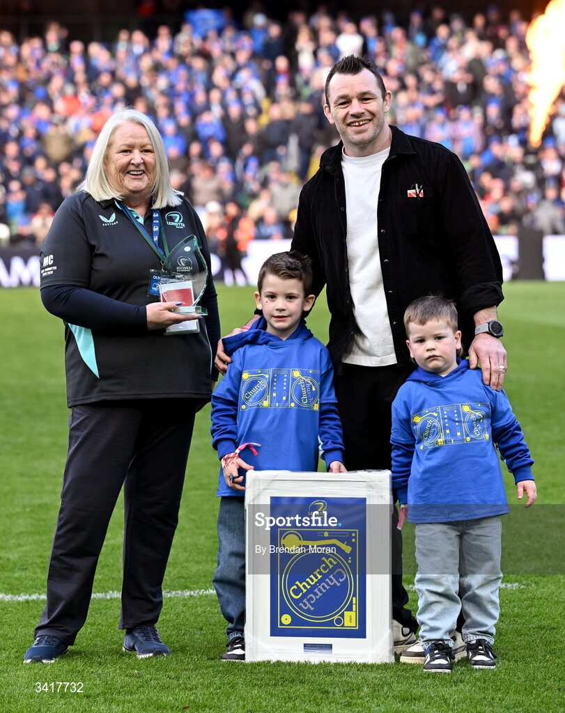 5 April 2026; OLSC committee member Mary Carroll makes a presentation to record Leinster cap holder Cian Healy, accompanied by his sons Russell and Beau, at half-time in the Investec Champions Cup match between Leinster and Edinburgh at the Aviva Stadium in Dublin. Photo by Brendan Moran/Sportsfile
