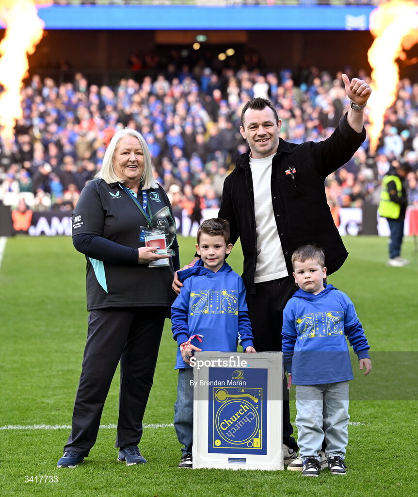 5 April 2026; OLSC committee member Mary Carroll makes a presentation to record Leinster cap holder Cian Healy, accompanied by his sons Russell and Beau, at half-time in the Investec Champions Cup match between Leinster and Edinburgh at the Aviva Stadium in Dublin. Photo by Brendan Moran/Sportsfile