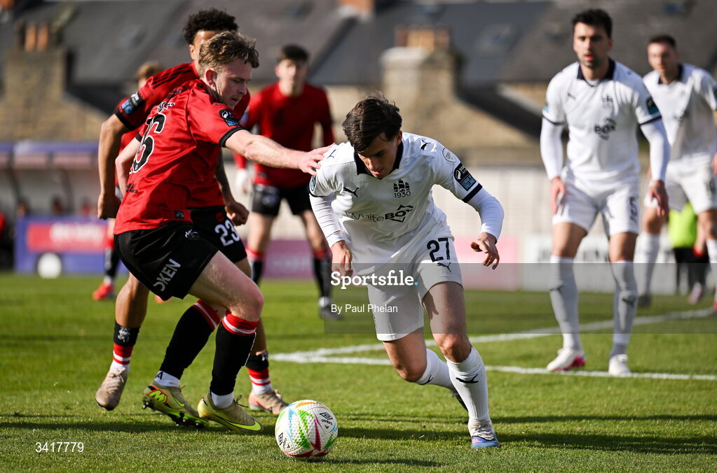 6 April 2026; Dean McMenamy of Waterford in action against Darragh Power of Bohemians during the SSE Airtricity Men's Premier Division match between Bohemians and Waterford at Dalymount Park in Dublin. Photo by Paul Phelan/Sportsfile