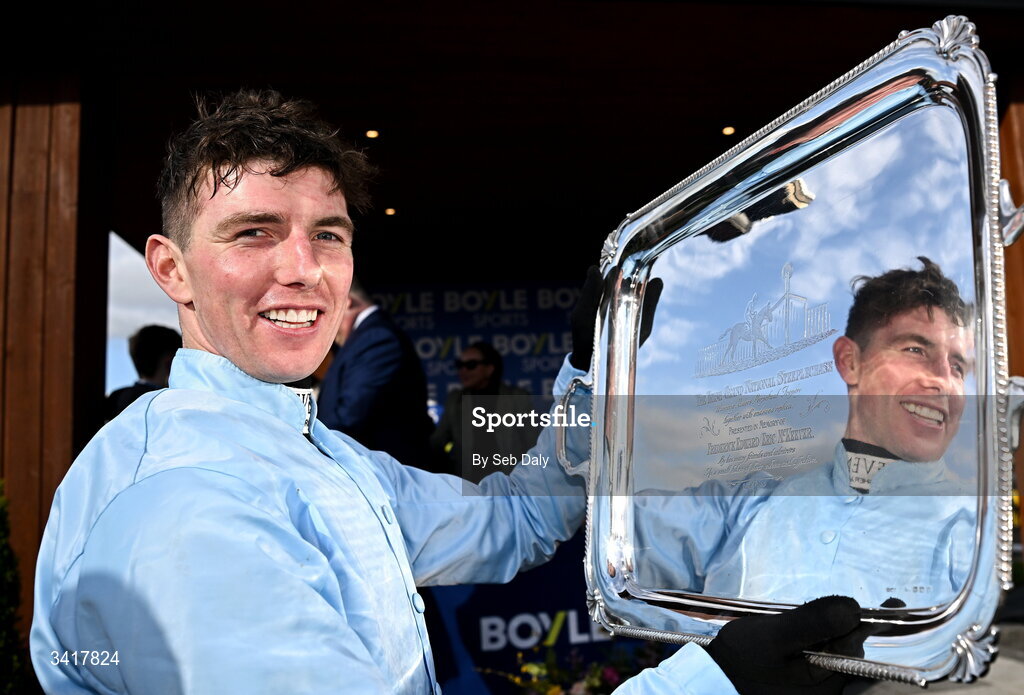 6 April 2026; Jockey Donagh Meyler celebrates with the trophy after winning the BOYLE Sports Irish Grand National Steeplechase on Soldier In Milan during day three of the Fairyhouse Easter Festival at Fairyhouse Racecourse in Ratoath, Meath. Photo by Seb Daly/Sportsfile