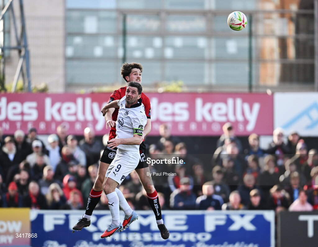 6 April 2026; Patrick Hickey of Bohemians in action against Pádraig Amond of Waterford during the SSE Airtricity Men's Premier Division match between Bohemians and Waterford at Dalymount Park in Dublin. Photo by Paul Phelan/Sportsfile