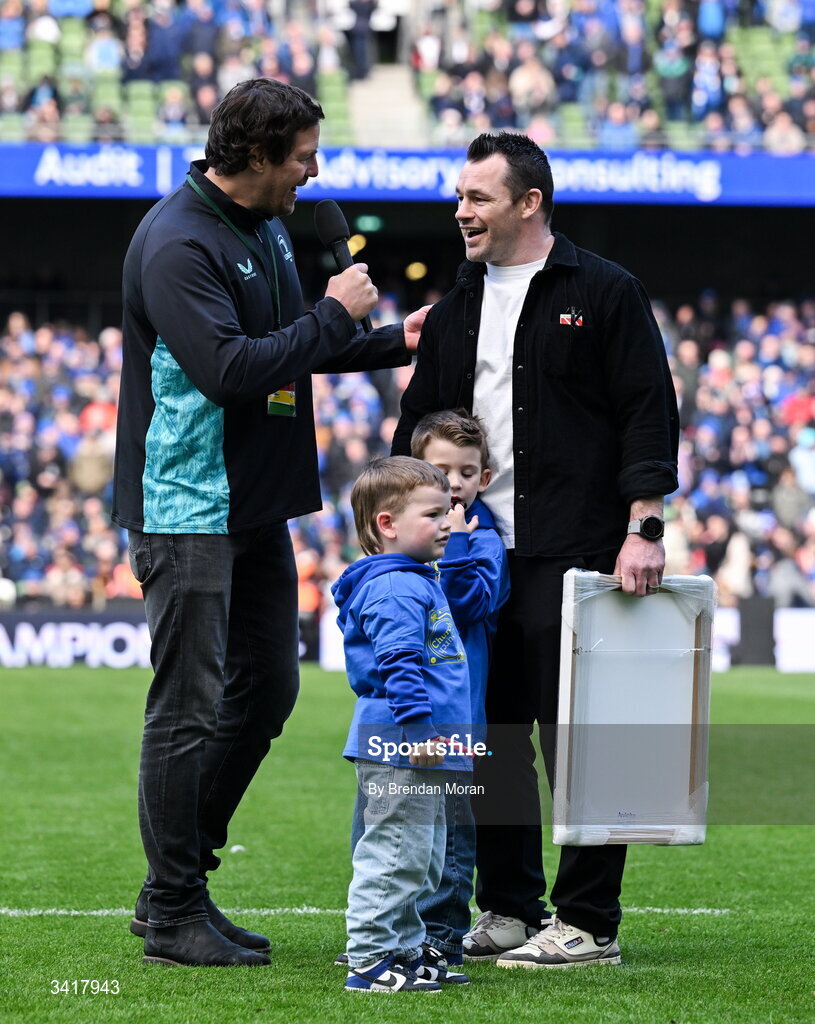 5 April 2026; Leinster record cap holder Cian Healy, accompanied by his sons Russell and Beau, is interviewed by MC Mike McCarthy, during half-time in the Investec Champions Cup match between Leinster and Edinburgh at the Aviva Stadium in Dublin. Photo by Brendan Moran/Sportsfile