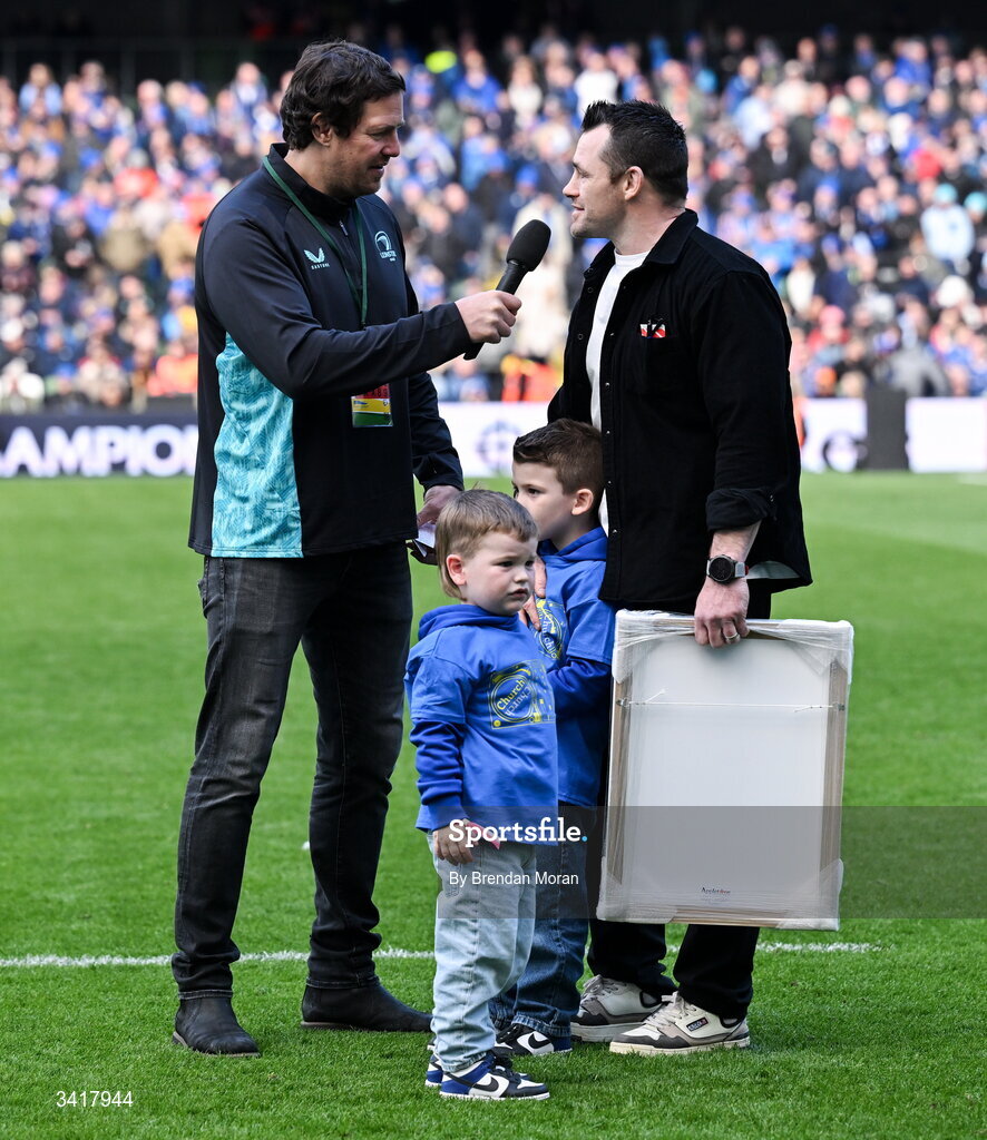 5 April 2026; Leinster record cap holder Cian Healy, accompanied by his sons Russell and Beau, is interviewed by MC Mike McCarthy, during half-time in the Investec Champions Cup match between Leinster and Edinburgh at the Aviva Stadium in Dublin. Photo by Brendan Moran/Sportsfile