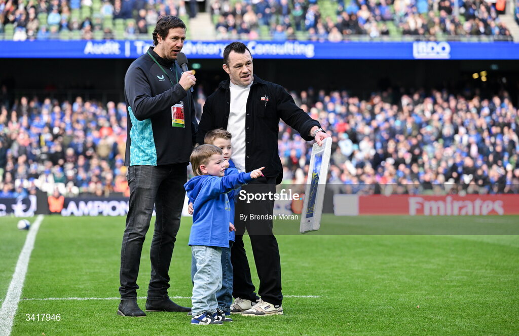 5 April 2026; Leinster record cap holder Cian Healy, accompanied by his sons Russell and Beau, is interviewed by MC Mike McCarthy, during half-time in the Investec Champions Cup match between Leinster and Edinburgh at the Aviva Stadium in Dublin. Photo by Brendan Moran/Sportsfile