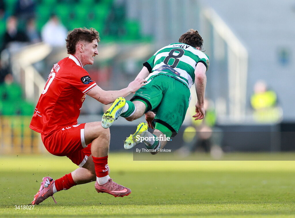 6 April 2026; Matt Healy of Shamrock Rovers is tackled by John Martin of Shelbourne during the SSE Airtricity Men's Premier Division match between Shamrock Rovers and Shelbourne at Tallaght Stadium in Dublin. Photo by Thomas Flinkow/Sportsfile
