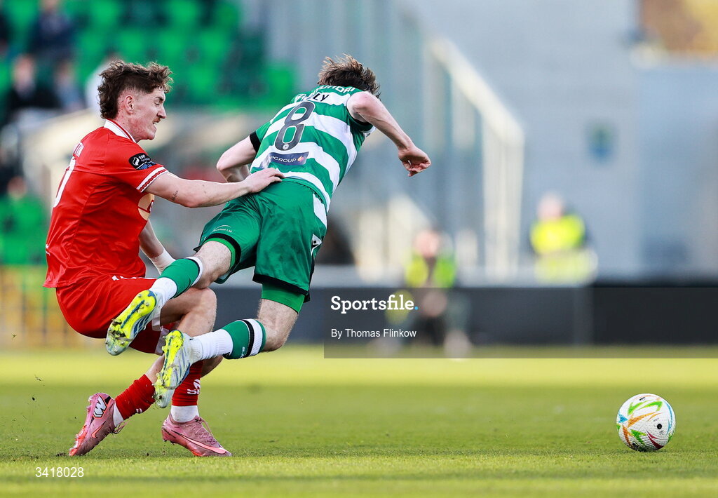 6 April 2026; Matt Healy of Shamrock Rovers is tackled by John Martin of Shelbourne during the SSE Airtricity Men's Premier Division match between Shamrock Rovers and Shelbourne at Tallaght Stadium in Dublin. Photo by Thomas Flinkow/Sportsfile