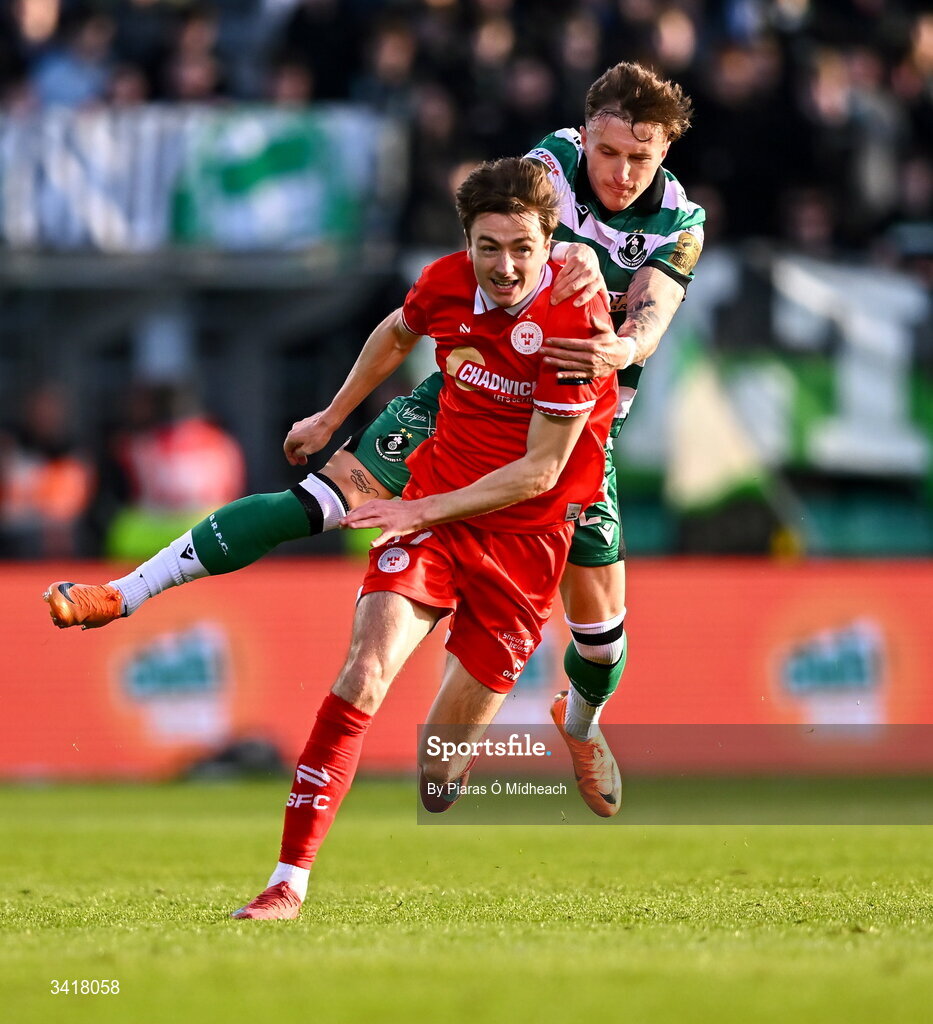 6 April 2026; Danny Grant of Shamrock Rovers pulls Daniel Kelly of Shelbourne back to stop him on an attack, before being shown a yellow card, during the SSE Airtricity Men's Premier Division match between Shamrock Rovers and Shelbourne at Tallaght Stadium in Dublin. Photo by Piaras Ó Mídheach/Sportsfile
