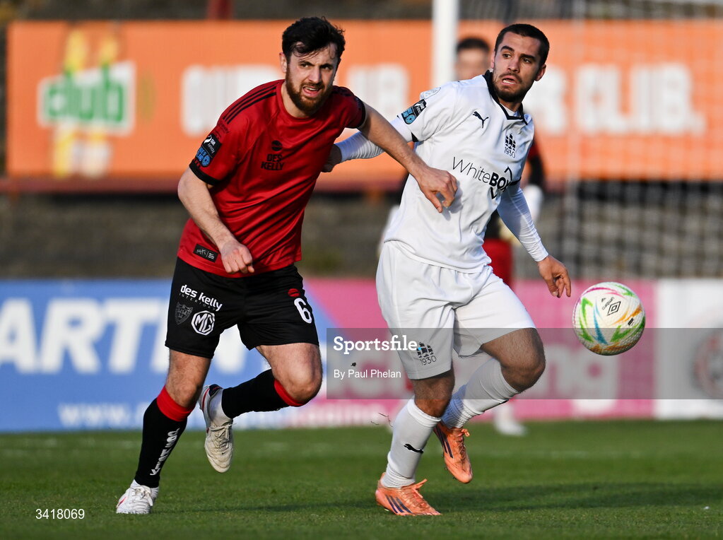 6 April 2026; Jordan Flores of Bohemians in action against Jordan Faria of Waterford during the SSE Airtricity Men's Premier Division match between Bohemians and Waterford at Dalymount Park in Dublin. Photo by Paul Phelan/Sportsfile
