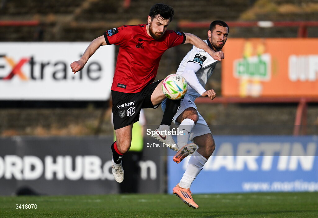 6 April 2026; Jordan Flores of Bohemians in action against Jordan Faria of Waterford during the SSE Airtricity Men's Premier Division match between Bohemians and Waterford at Dalymount Park in Dublin. Photo by Paul Phelan/Sportsfile