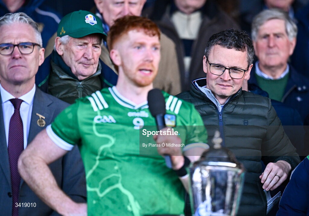 5 April 2026; Patrick O'Donovan, Minister for Arts, Culture, Communications, Media and Sport looks on as Limerick captain Cian Lynch makes a victory speech after the Allianz Hurling League Division 1A final match between Limerick and Cork at TUS Gaelic Grounds in Limerick. Photo by Piaras Ó Mídheach/Sportsfile