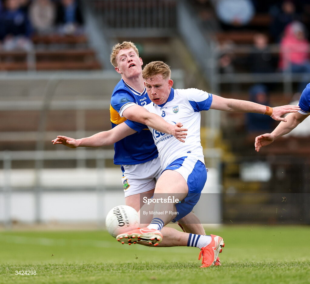 12 April 2026; Michael O'Brien of Waterford shoots to score his side's first goal despite the attention of Killian Butler of Tipperary during the Munster GAA Football Senior Championship quarter-final match between Waterford and Tipperary at Cappoquin Logistics Fraher Field in Waterford. Photo by Michael P Ryan/Sportsfile