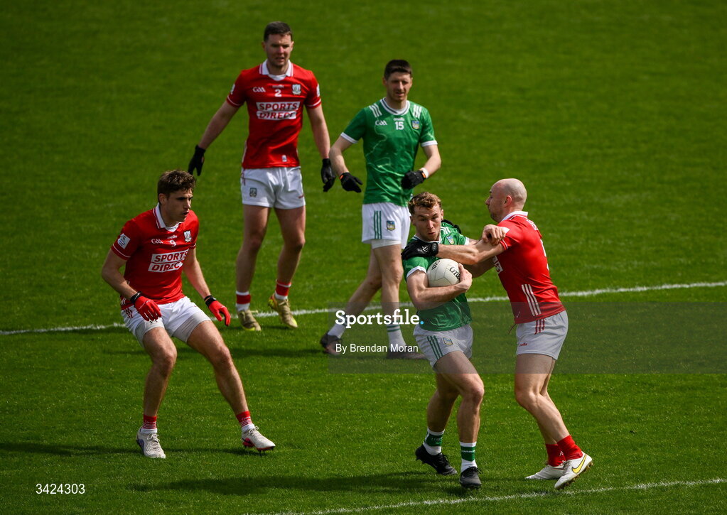 12 April 2026; Eliah Riordan of Limerick is tackled by Brian O’Driscoll of Cork during the Munster GAA Football Senior Championship quarter-final match between Cork and Limerick at SuperValu Páirc Uí Chaoimh in Cork. Photo by Brendan Moran/Sportsfile