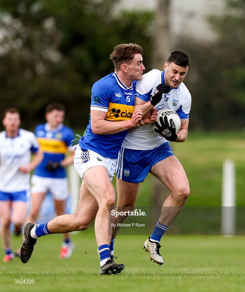 12 April 2026; Darach O'Cathasaigh of Waterford in action against James Morris of Tipperary during the Munster GAA Football Senior Championship quarter-final match between Waterford and Tipperary at Cappoquin Logistics Fraher Field in Waterford. Photo by Michael P Ryan/Sportsfile