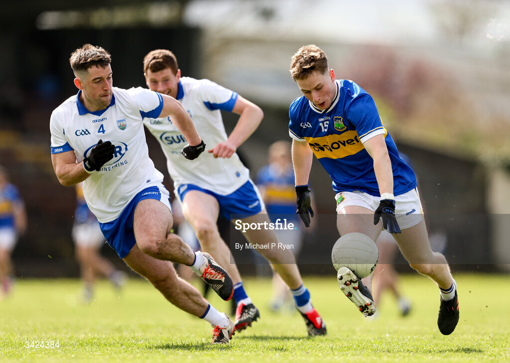 12 April 2026; Daithi Hogan of Tipperary in action against Conor Ó Cuirrín of Waterford during the Munster GAA Football Senior Championship quarter-final match between Waterford and Tipperary at Cappoquin Logistics Fraher Field in Waterford. Photo by Michael P Ryan/Sportsfile