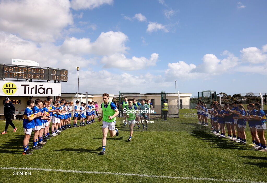 12 April 2026; Tipperary players run out before the Munster GAA Football Senior Championship quarter-final match between Waterford and Tipperary at Cappoquin Logistics Fraher Field in Waterford. Photo by Michael P Ryan/Sportsfile