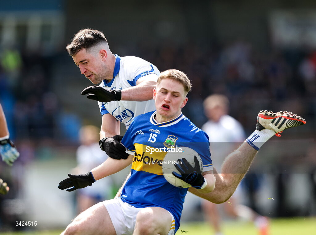 12 April 2026; Daithi Hogan of Tipperary in action against Conor Ó Cuirrín of Waterford during the Munster GAA Football Senior Championship quarter-final match between Waterford and Tipperary at Cappoquin Logistics Fraher Field in Waterford. Photo by Michael P Ryan/Sportsfile
