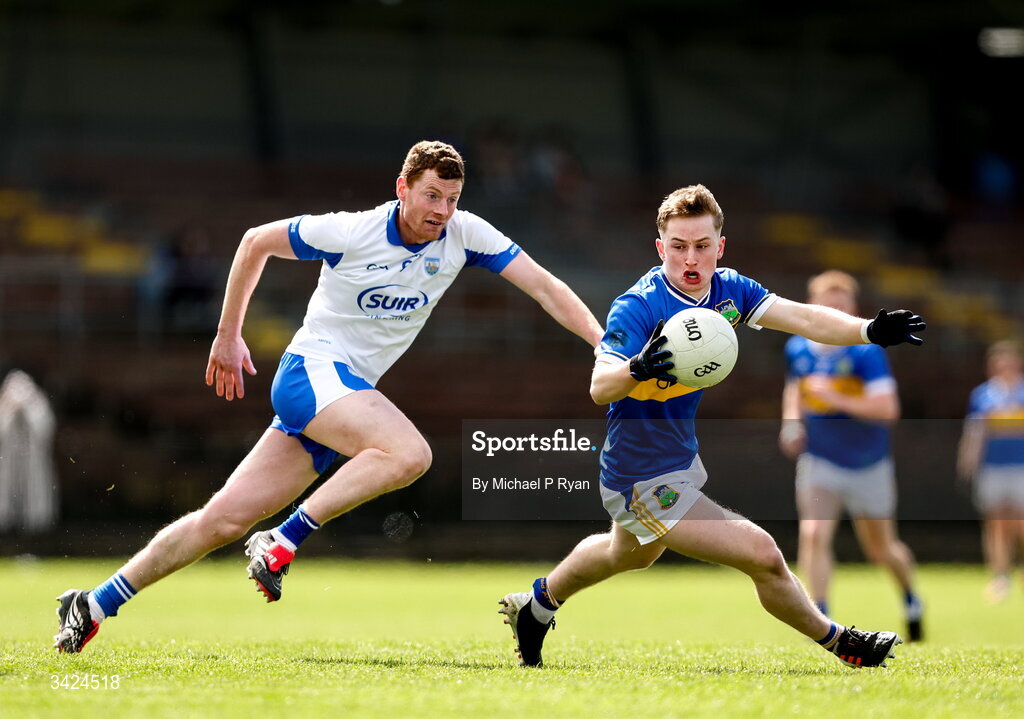 12 April 2026; Daithi Hogan of Tipperary in action against Michael Curry of Waterford during the Munster GAA Football Senior Championship quarter-final match between Waterford and Tipperary at Cappoquin Logistics Fraher Field in Waterford. Photo by Michael P Ryan/Sportsfile