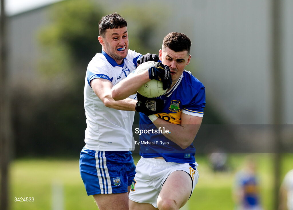 12 April 2026; Sean O'Connor of Tipperary in action against Darach O'Cathasaigh of Waterford during the Munster GAA Football Senior Championship quarter-final match between Waterford and Tipperary at Cappoquin Logistics Fraher Field in Waterford. Photo by Michael P Ryan/Sportsfile