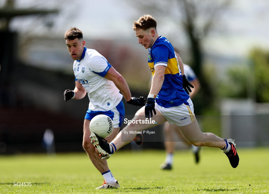 12 April 2026; Daithi Hogan of Tipperary in action against Conor Ó Cuirrín of Waterford during the Munster GAA Football Senior Championship quarter-final match between Waterford and Tipperary at Cappoquin Logistics Fraher Field in Waterford. Photo by Michael P Ryan/Sportsfile