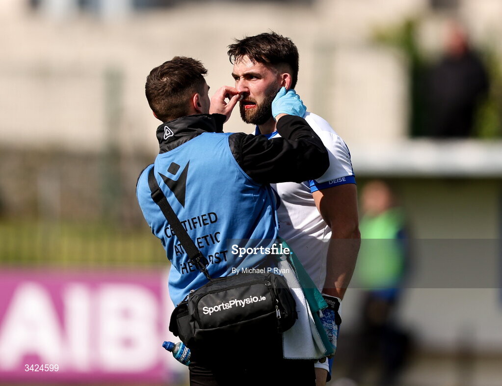 12 April 2026; Adam Crawford of Waterford receives medical attention during the Munster GAA Football Senior Championship quarter-final match between Waterford and Tipperary at Cappoquin Logistics Fraher Field in Waterford. Photo by Michael P Ryan/Sportsfile