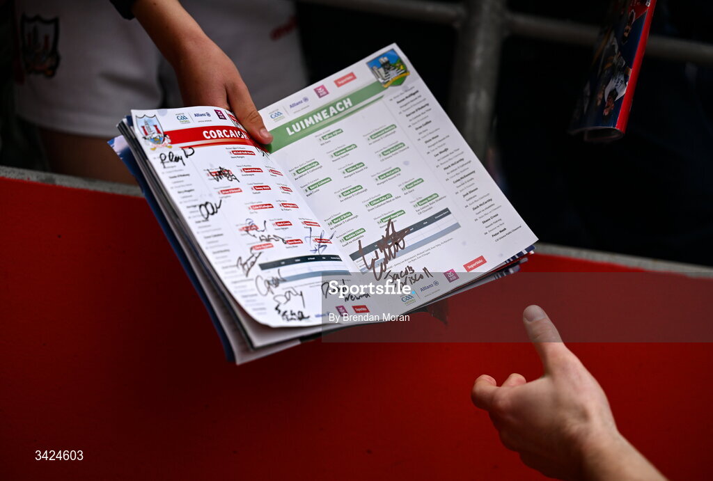 12 April 2026; A young supporter hands a match programme to Chris Óg Jones of Cork for an autograph after the Munster GAA Football Senior Championship quarter-final match between Cork and Limerick at SuperValu Páirc Uí Chaoimh in Cork. Photo by Brendan Moran/Sportsfile