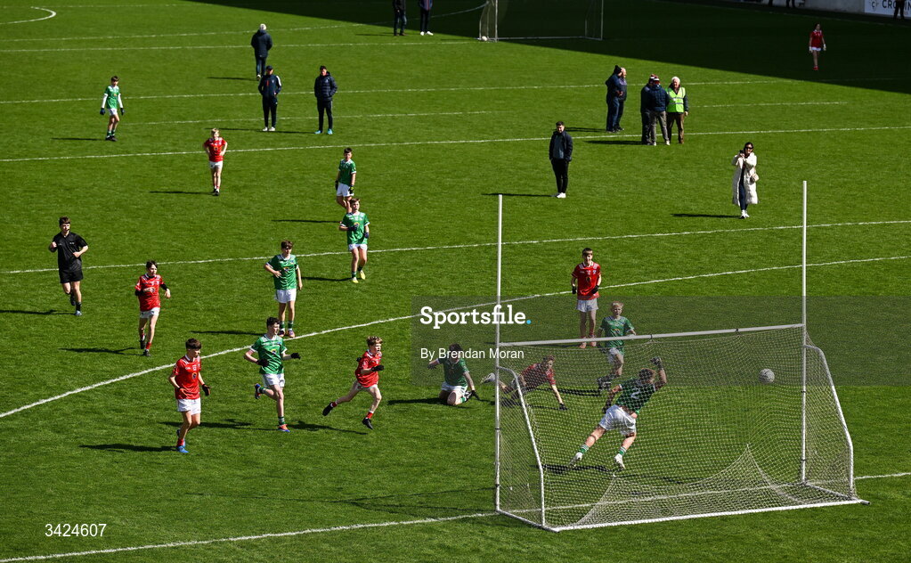 12 April 2026; Seán Ó Laocha of Gaelscoil Uí Drisceoil, Gleann Maghair, falling, watches his shot hit the net for a goal for Cork, during the Munster GAA Prinmary Games, at half-time in the Munster GAA Football Senior Championship quarter-final match between Cork and Limerick at SuperValu Páirc Uí Chaoimh in Cork. Photo by Brendan Moran/Sportsfile