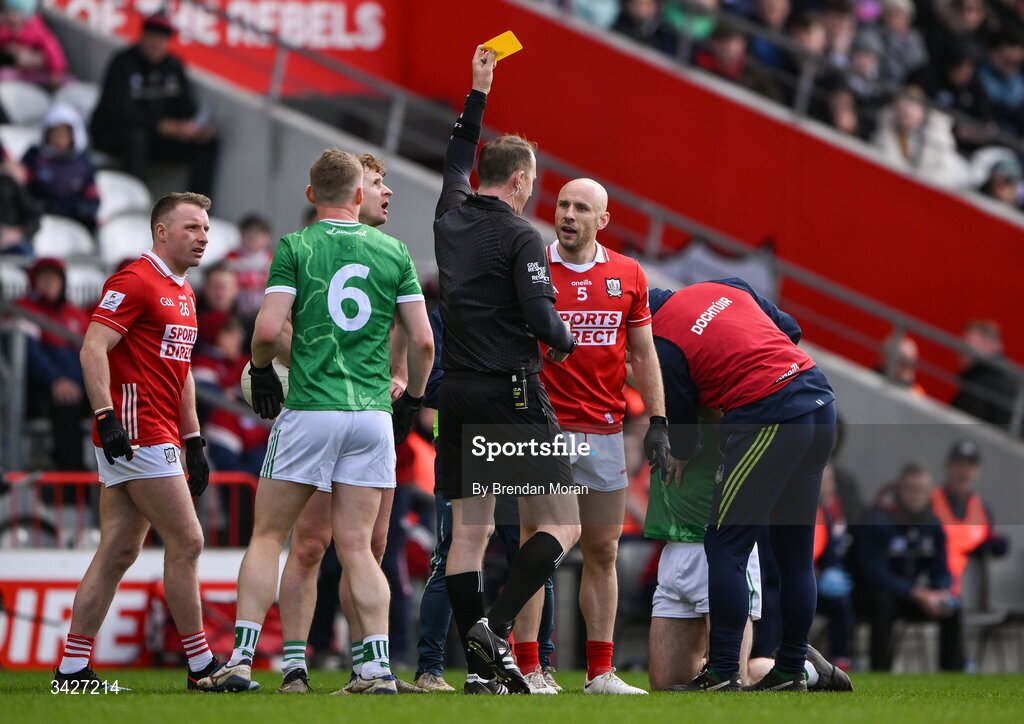 12 April 2026; Brian O’Driscoll of Cork, 5, is shown a yellow card, before being shown a red card by referee Séamus Mulhare during the Munster GAA Football Senior Championship quarter-final match between Cork and Limerick at SuperValu Páirc Uí Chaoimh in Cork. Photo by Brendan Moran/Sportsfile