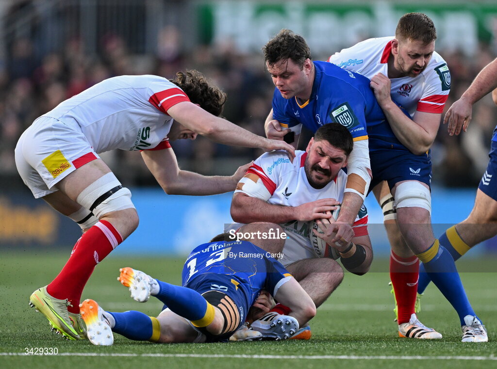 17 April 2026; Tom O'Toole of Ulster is tackled by Garry Ringrose and James Ryan of Leinster during the United Rugby Championship match between Ulster and Leinster at Affidea Stadium in Belfast. Photo by Ramsey Cardy/Sportsfile