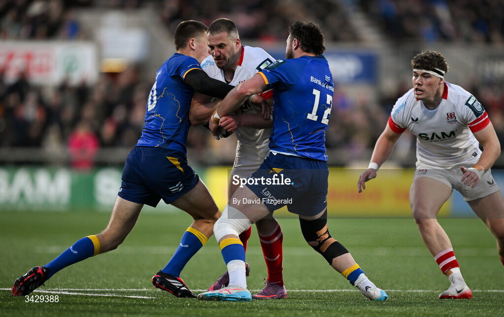 17 April 2026; Stuart McCloskey of Ulster is tackled by Sam Prendergast, left, and Robbie Henshaw of Leinster during the United Rugby Championship match between Ulster and Leinster at Affidea Stadium in Belfast. Photo by David Fitzgerald/Sportsfile