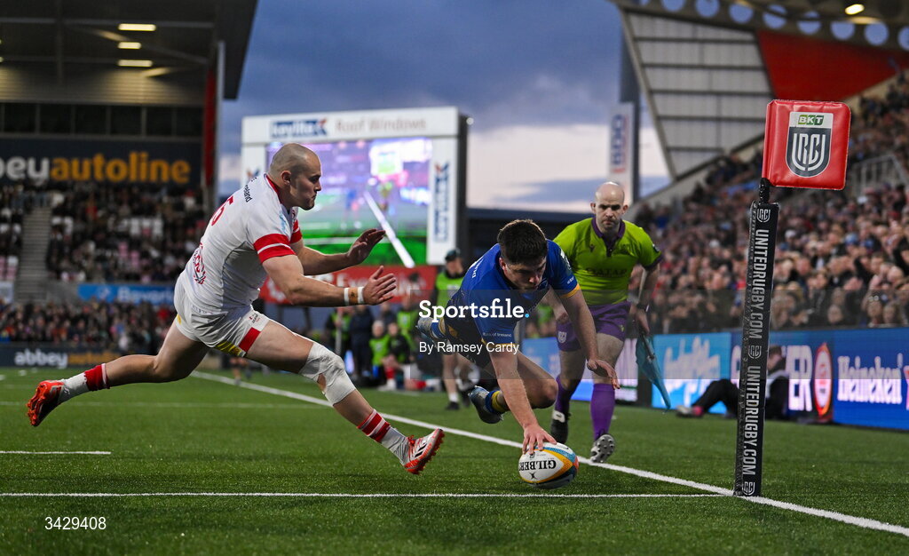 17 April 2026; Jimmy O'Brien of Leinster dives over to score his side's second try despite the tackle of Jacob Stockdale of Ulster during the United Rugby Championship match between Ulster and Leinster at Affidea Stadium in Belfast. Photo by Ramsey Cardy/Sportsfile