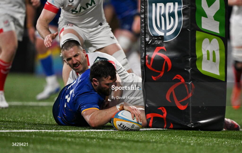17 April 2026; Robbie Henshaw of Leinster scores his side's third try despite the tackle from Stuart McCloskey of Ulster during the United Rugby Championship match between Ulster and Leinster at Affidea Stadium in Belfast. Photo by David Fitzgerald/Sportsfile