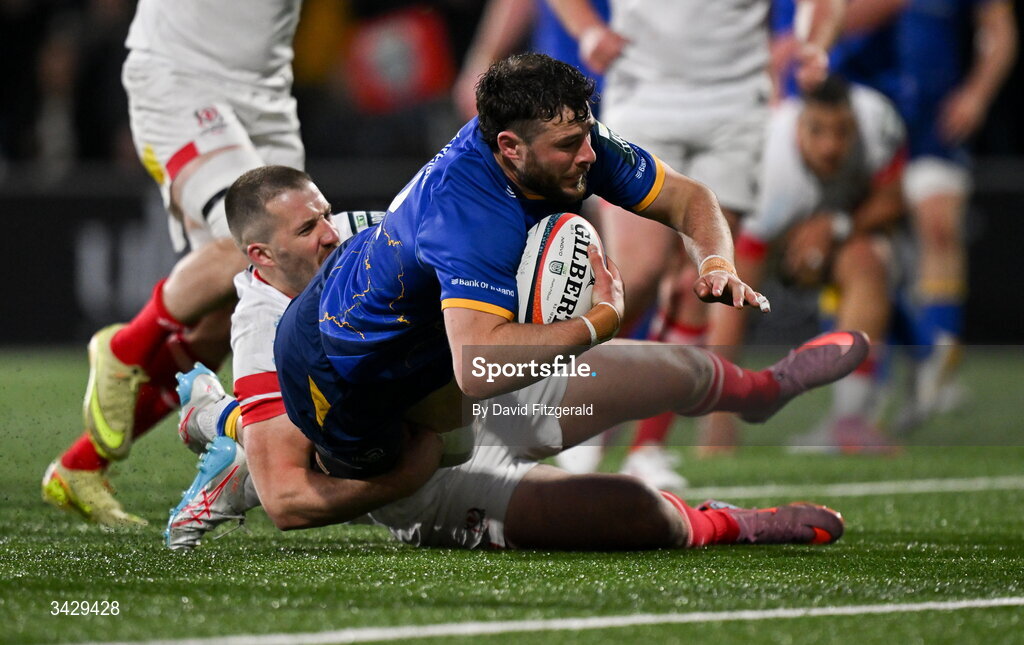 17 April 2026; Robbie Henshaw of Leinster scores his side's third try despite the tackle from Stuart McCloskey of Ulster during the United Rugby Championship match between Ulster and Leinster at Affidea Stadium in Belfast. Photo by David Fitzgerald/Sportsfile