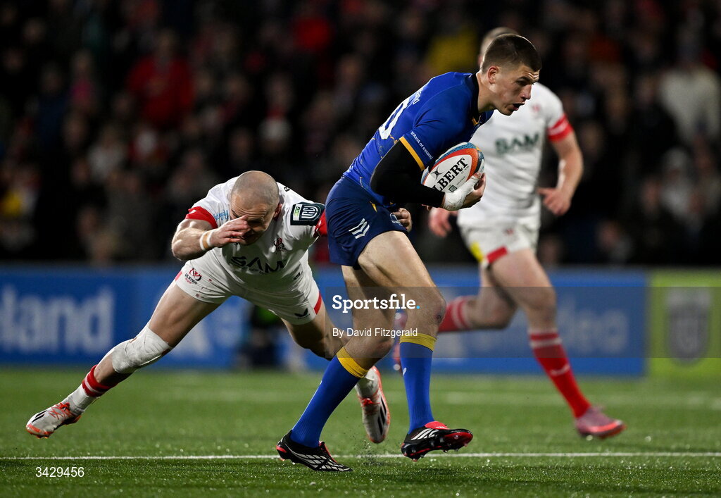 17 April 2026; Sam Prendergast of Leinster is tackled by Jacob Stockdale of Ulster during the United Rugby Championship match between Ulster and Leinster at Affidea Stadium in Belfast. Photo by David Fitzgerald/Sportsfile