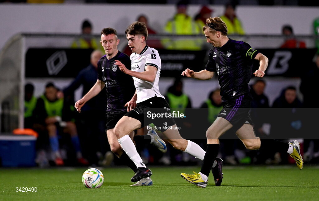 17 April 2026; Eoin Kenny of Dundalk in action against Lee Devitt, left, and David Hurley of Galway United during the SSE Airtricity Men's Premier Division match between Dundalk and Galway United at Oriel Park in Dundalk, Louth. Photo by Ben McShane/Sportsfile