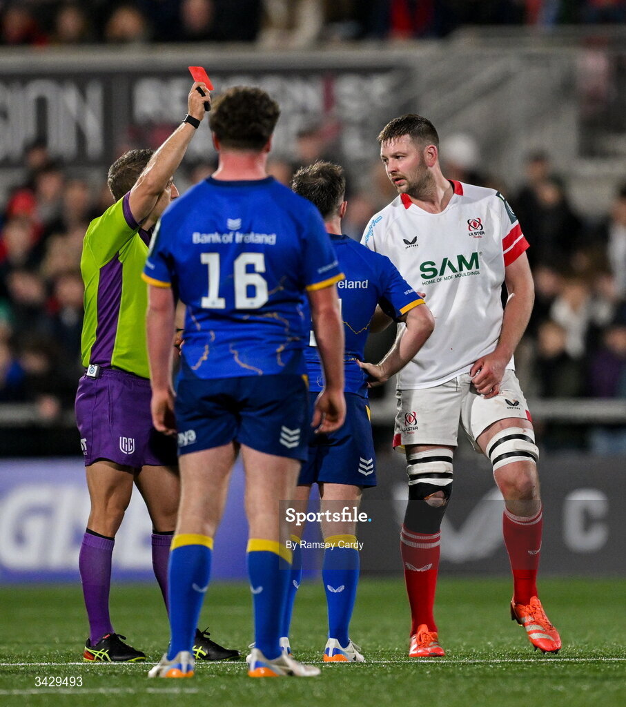 17 April 2026; Referee Andrew Brace shows a red card to Max Deegan of Leinster, not pictured, during the United Rugby Championship match between Ulster and Leinster at Affidea Stadium in Belfast. Photo by Ramsey Cardy/Sportsfile
