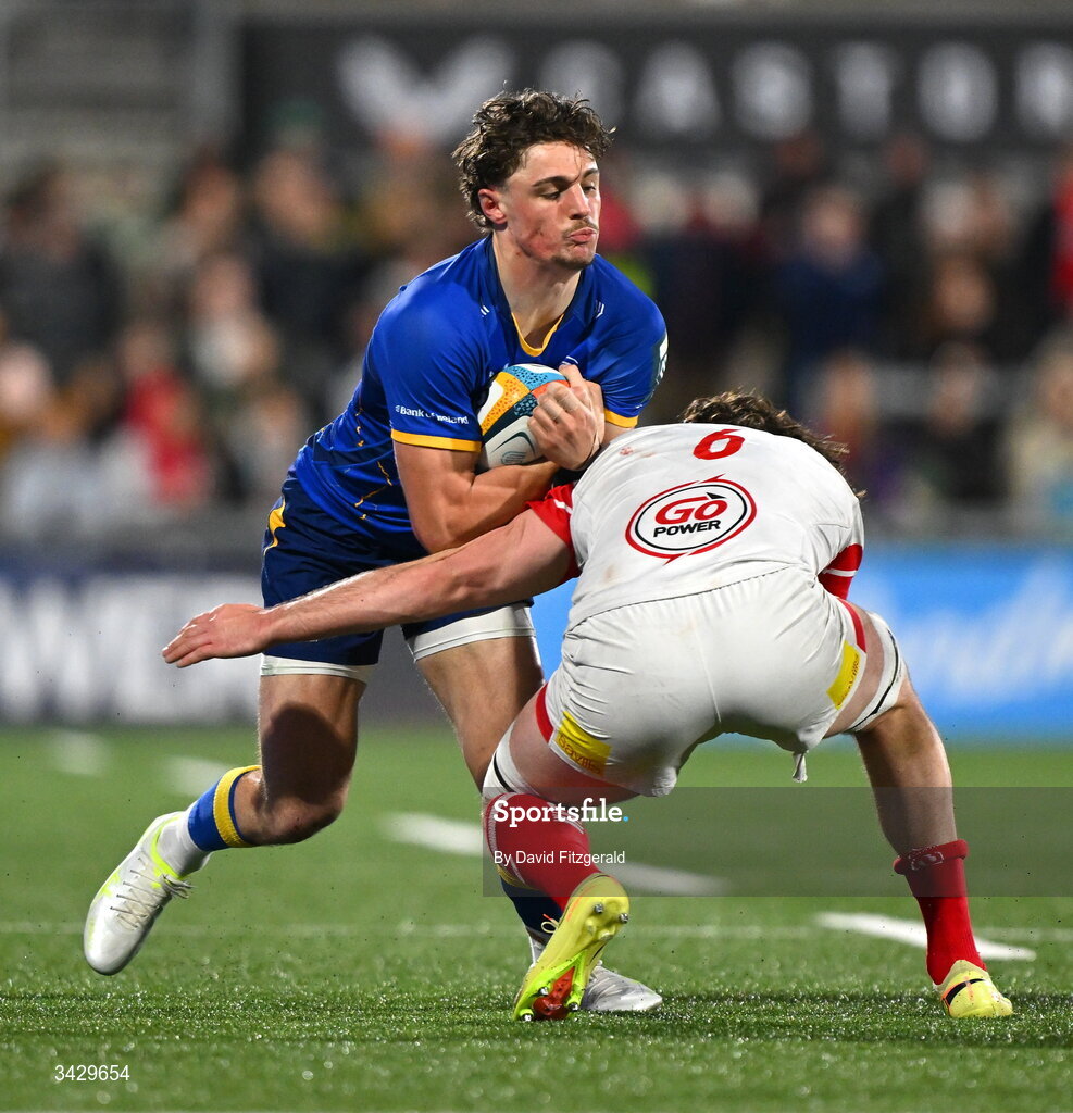 17 April 2026; Joshua Kenny of Leinster is tackled by David McCann of Ulster during the United Rugby Championship match between Ulster and Leinster at Affidea Stadium in Belfast. Photo by David Fitzgerald/Sportsfile