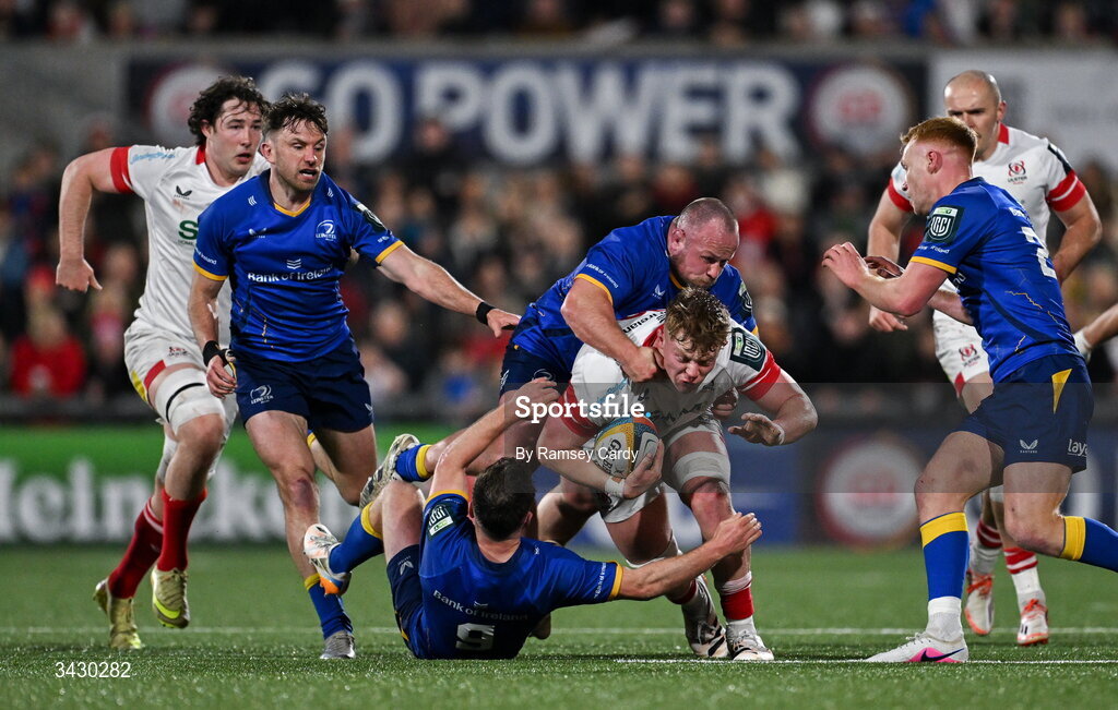 17 April 2026; Bryn Ward of Ulster is tackled by Ed Byrne and Luke McGrath of Leinster during the United Rugby Championship match between Ulster and Leinster at Affidea Stadium in Belfast. Photo by Ramsey Cardy/Sportsfile