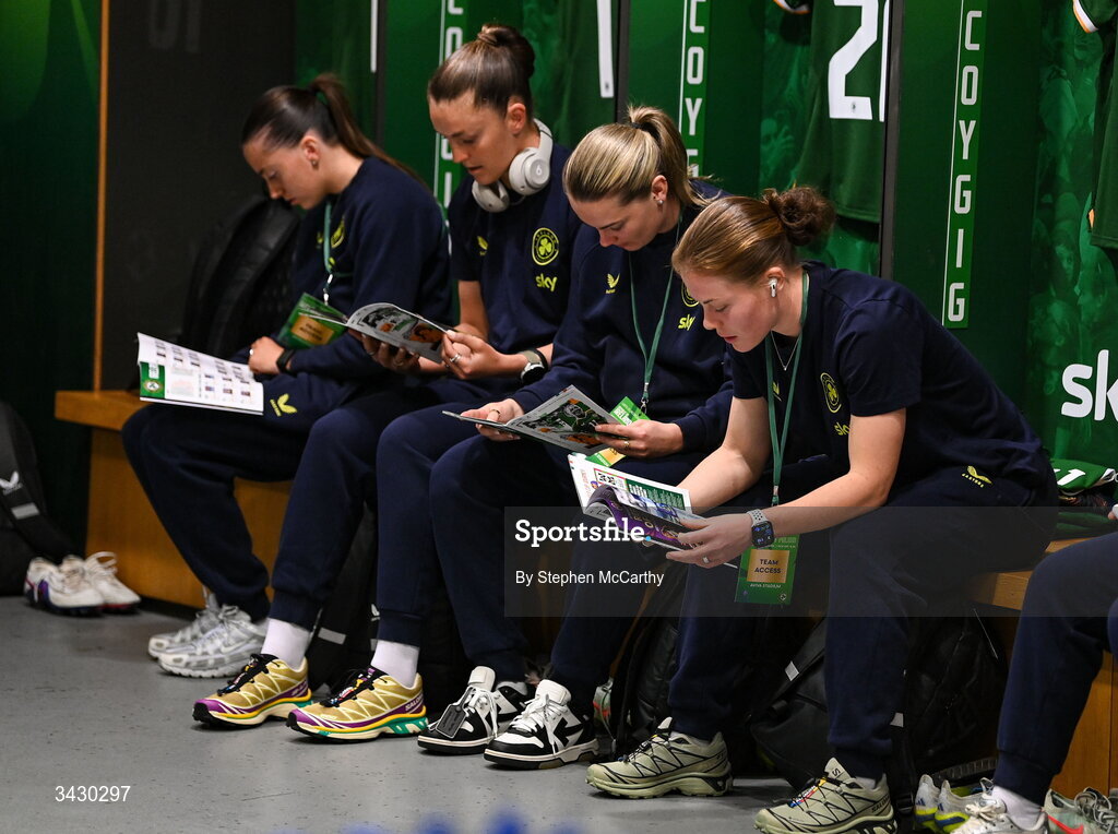 18 April 2026; Republic of Ireland players, from left, Abbie Larkin, Caitlin Hayes, Saoirse Noonan and Emily Murphy inspect the matchday programme before the 2027 FIFA Women’s World Cup Qualifier match between Republic of Ireland and Poland at the Aviva Stadium in Dublin. Photo by Stephen McCarthy/Sportsfile