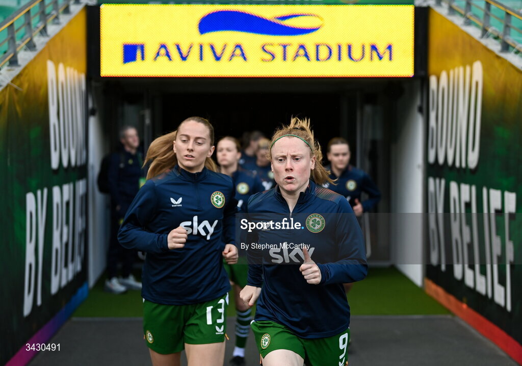 18 April 2026; Amber Barrett, right, and Aoibheann Clancy run out before the 2027 FIFA Women’s World Cup Qualifier match between Republic of Ireland and Poland at the Aviva Stadium in Dublin. Photo by Stephen McCarthy/Sportsfile