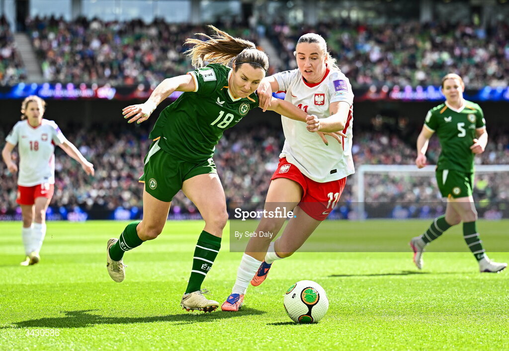 18 April 2026; Kyra Carusa of Republic of Ireland in action against Tanja Pawollek of Poland during the 2027 FIFA Women’s World Cup Qualifier match between Republic of Ireland and Poland at the Aviva Stadium in Dublin. Photo by Seb Daly/Sportsfile