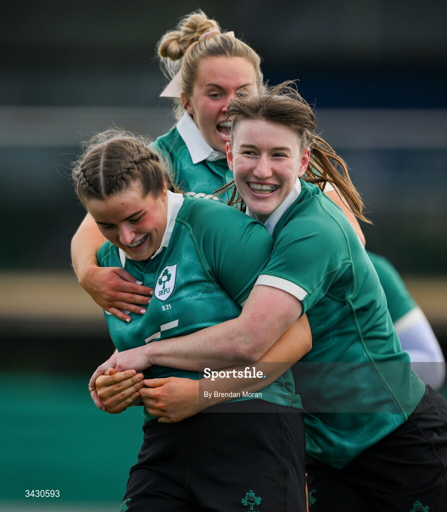 18 April 2026; Katie Corrigan of Ireland, left, celebrates with teammates Niamh Gallagher and Lucia Linn after scoring their side's sixth try during the Women's U21 Six Nations Series match between Ireland and Italy at Dexcom Stadium in Galway. Photo by Brendan Moran/Sportsfile