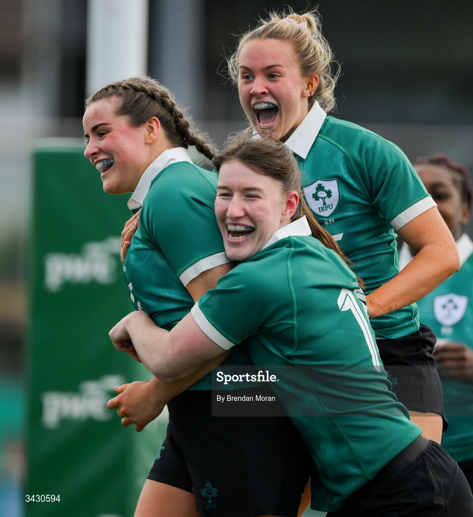 18 April 2026; Katie Corrigan of Ireland, left, celebrates with teammates Niamh Gallagher and Lucia Linn after scoring their side's sixth try during the Women's U21 Six Nations Series match between Ireland and Italy at Dexcom Stadium in Galway. Photo by Brendan Moran/Sportsfile