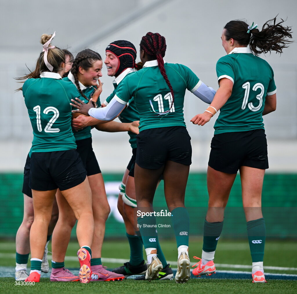 18 April 2026; Katie Corrigan of Ireland, centre, is congratulated by team-mates after scoring their side's sixth try during the Women's U21 Six Nations Series match between Ireland and Italy at Dexcom Stadium in Galway. Photo by Shauna Clinton/Sportsfile