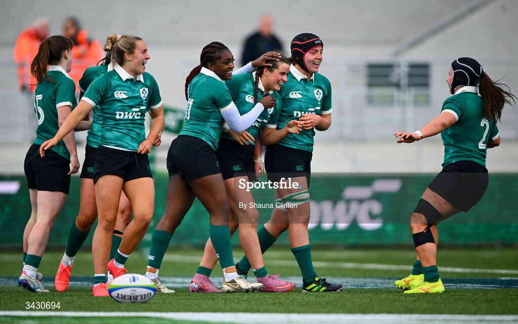 18 April 2026; Katie Corrigan of Ireland, centre, is congratulated by team-mates after scoring their side's sixth try during the Women's U21 Six Nations Series match between Ireland and Italy at Dexcom Stadium in Galway. Photo by Shauna Clinton/Sportsfile