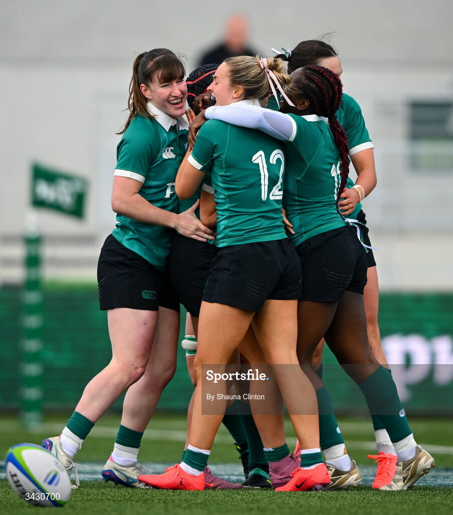 18 April 2026; Katie Corrigan of Ireland, centre, is congratulated by team-mates after scoring their side's sixth try during the Women's U21 Six Nations Series match between Ireland and Italy at Dexcom Stadium in Galway. Photo by Shauna Clinton/Sportsfile