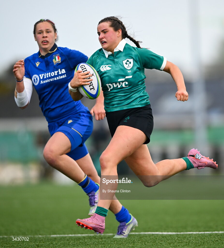 18 April 2026; Katie Corrigan of Ireland makes a break on her way to scoring her side's sixth try during the Women's U21 Six Nations Series match between Ireland and Italy at Dexcom Stadium in Galway. Photo by Shauna Clinton/Sportsfile