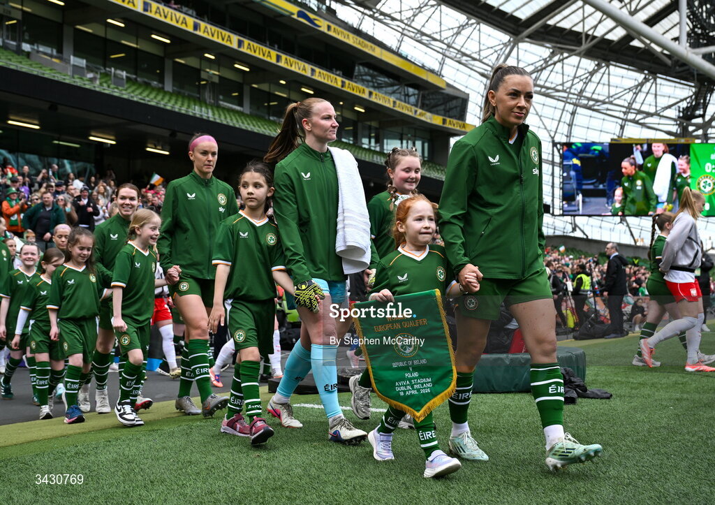 18 April 2026; Katie McCabe of Republic of Ireland leads out the team before the 2027 FIFA Women’s World Cup Qualifier match between Republic of Ireland and Poland at the Aviva Stadium in Dublin. Photo by Stephen McCarthy/Sportsfile