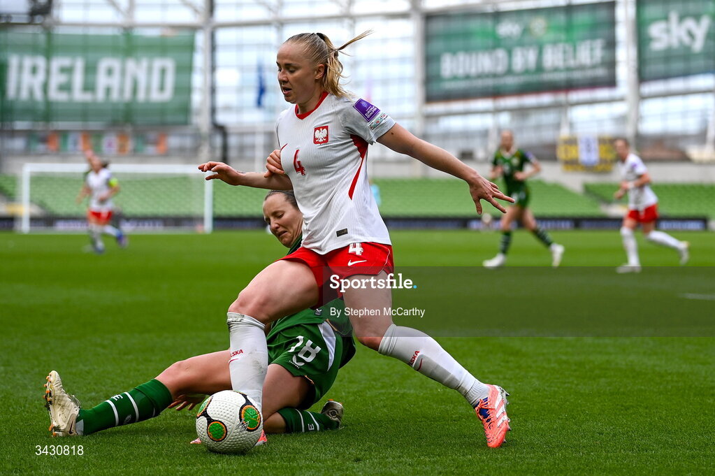 18 April 2026; Paulina Dudek of Poland is tackled by Kyra Carusa of Republic of Ireland during the 2027 FIFA Women’s World Cup Qualifier match between Republic of Ireland and Poland at the Aviva Stadium in Dublin. Photo by Stephen McCarthy/Sportsfile