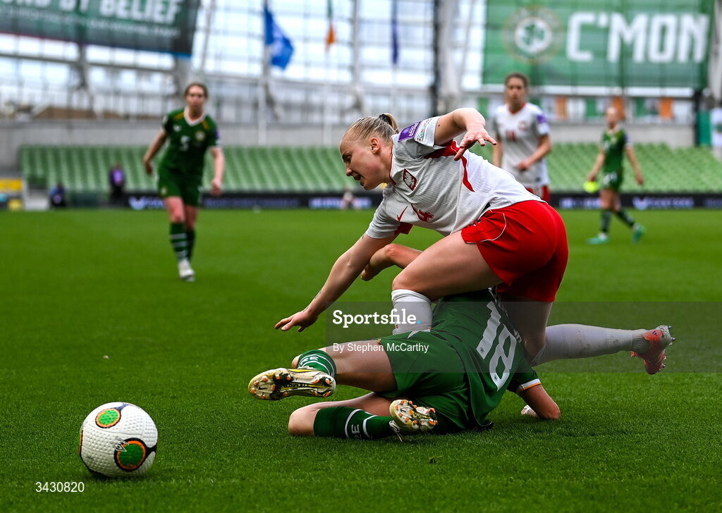 18 April 2026; Paulina Dudek of Poland is tackled by Kyra Carusa of Republic of Ireland during the 2027 FIFA Women’s World Cup Qualifier match between Republic of Ireland and Poland at the Aviva Stadium in Dublin. Photo by Stephen McCarthy/Sportsfile