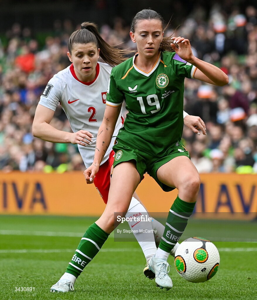 18 April 2026; Abbie Larkin of Republic of Ireland in action against Martyna Wiankowska of Poland during the 2027 FIFA Women’s World Cup Qualifier match between Republic of Ireland and Poland at the Aviva Stadium in Dublin. Photo by Stephen McCarthy/Sportsfile